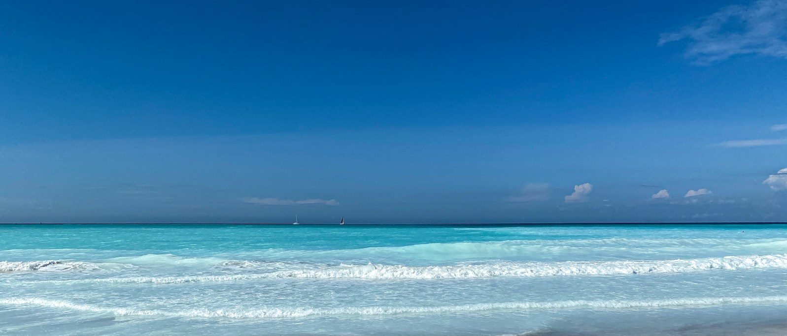 blue sea under blue sky during daytime